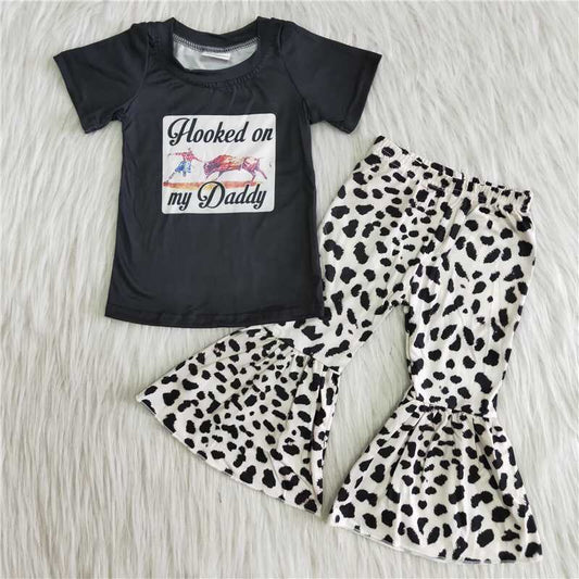 horse black top leopard pants outfit